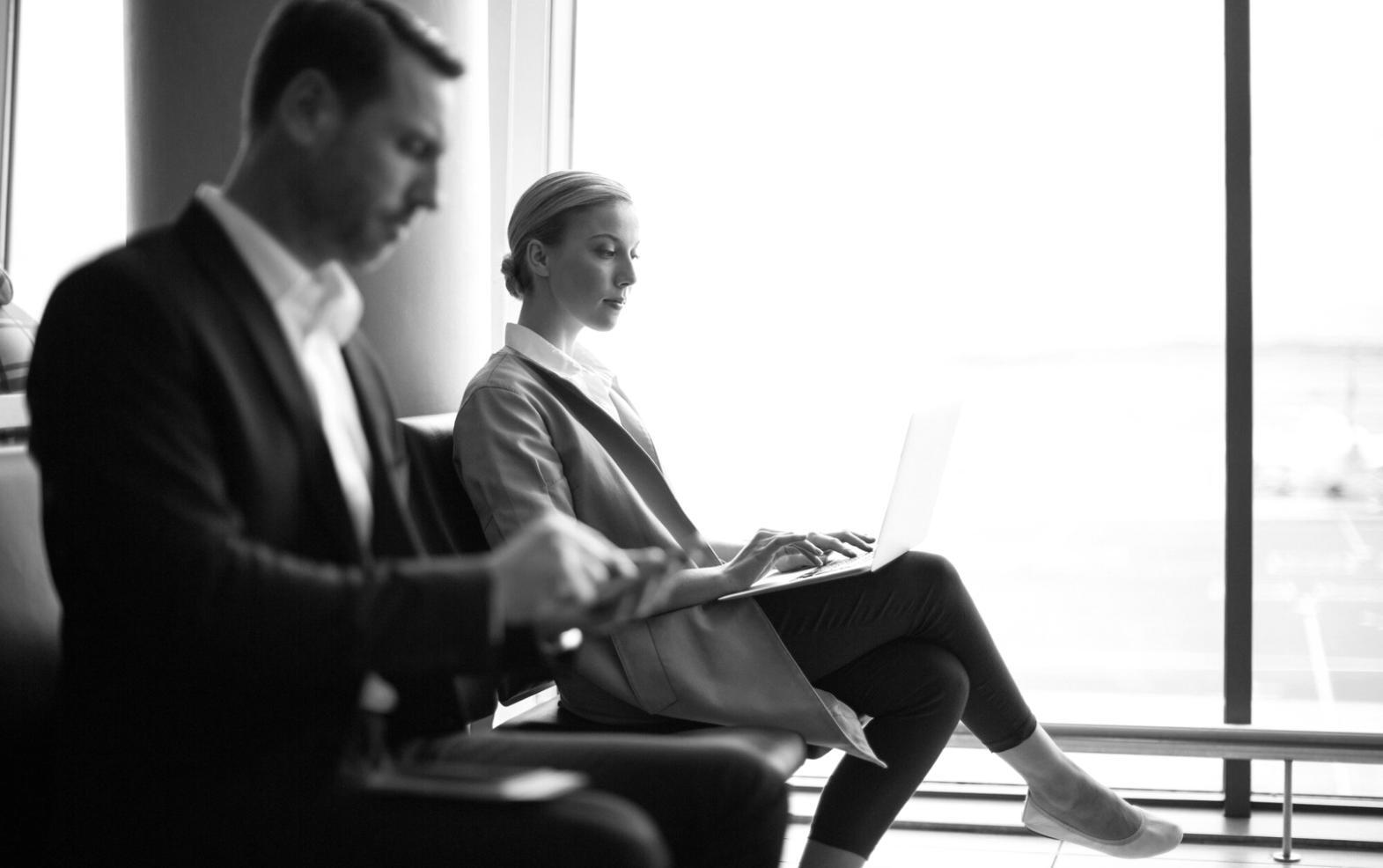 Person reviewing financial documents with calculator and charts